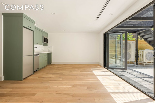 interior space with recessed lighting, baseboards, and light wood-type flooring