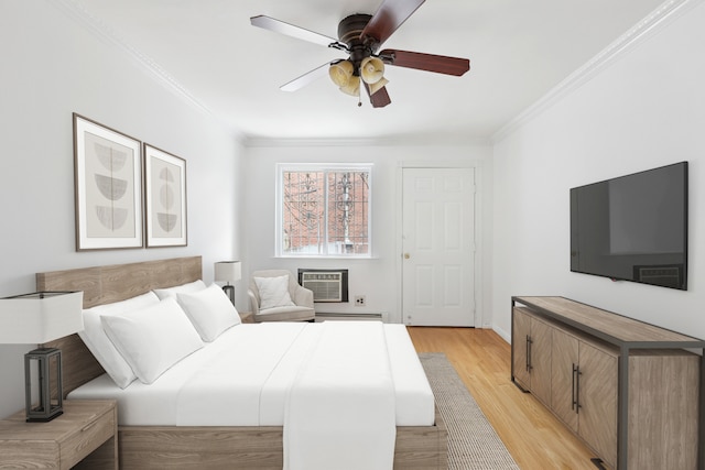 bedroom with ceiling fan, ornamental molding, a wall mounted air conditioner, and light wood-style flooring