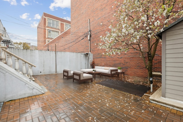 view of patio / terrace with outdoor lounge area and fence