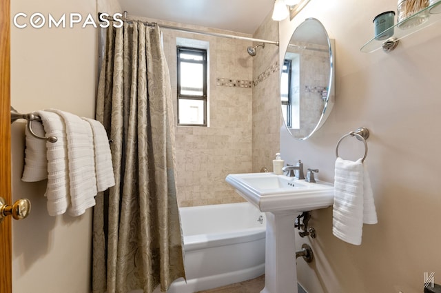 bathroom featuring shower / bath combo with shower curtain