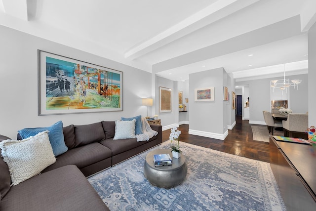 living room featuring baseboards, recessed lighting, wood finished floors, and a notable chandelier
