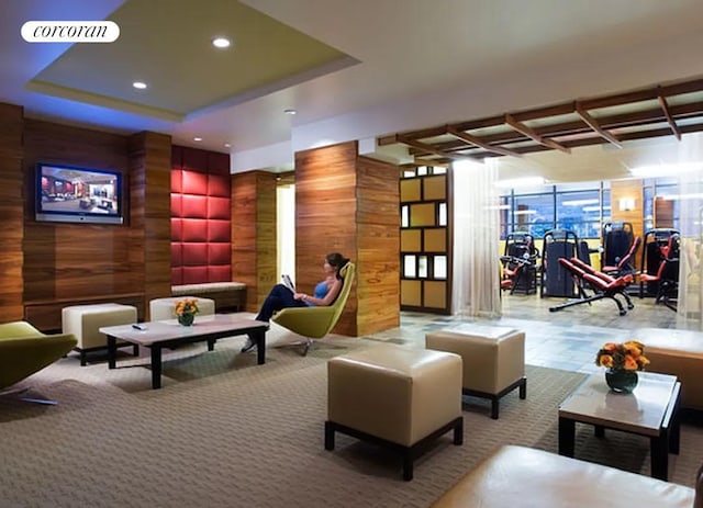 lobby featuring recessed lighting and wooden walls