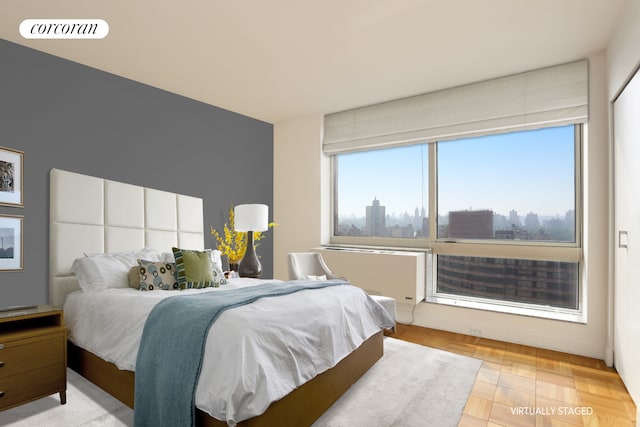 bedroom with a view of city