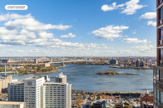 water view featuring a notable bridge and nearby urban area