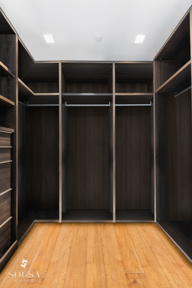 spacious closet featuring light wood-type flooring