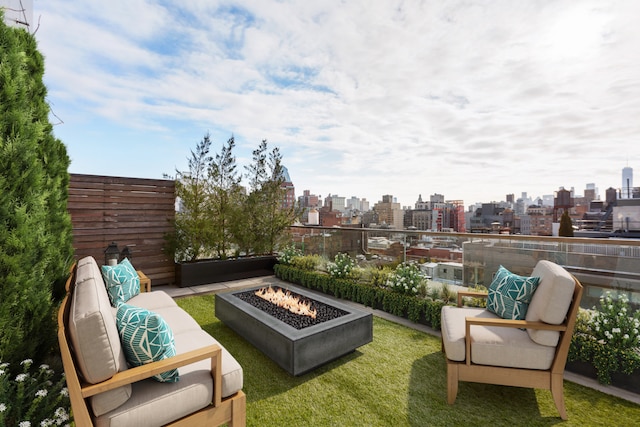 view of patio / terrace featuring a city view and a fire pit