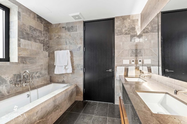 full bath featuring tile walls, a sink, and a bath