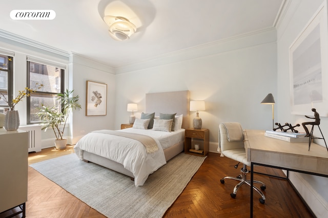bedroom featuring crown molding, baseboards, radiator, and visible vents