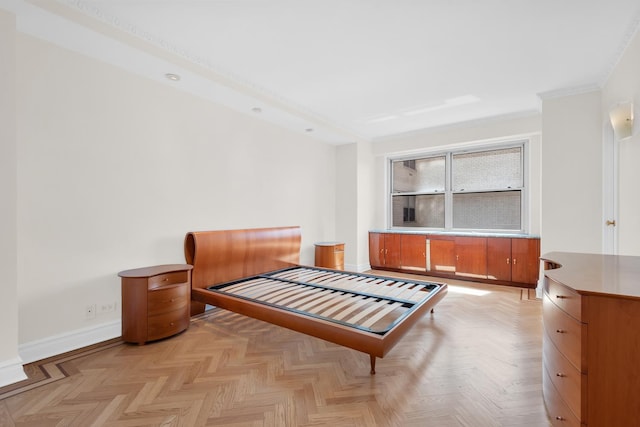 bedroom featuring baseboards and ornamental molding