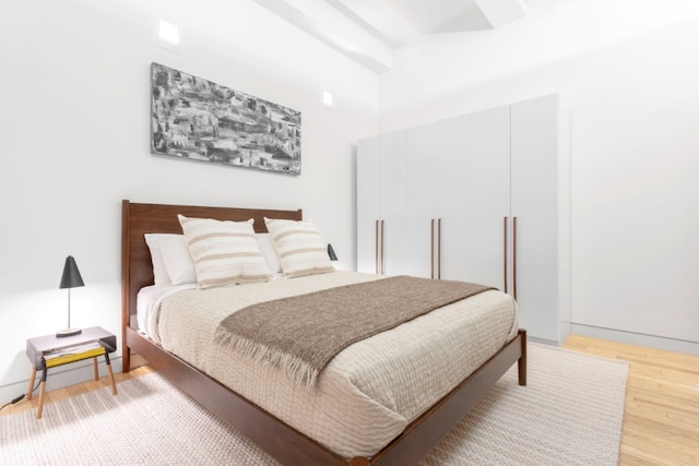 bedroom featuring light wood-style floors
