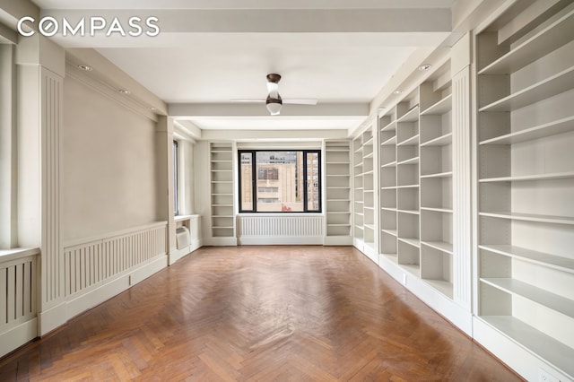 50 Park Ave Unit 15B, New York City, NY 10016 - empty room featuring radiator and built in shelves