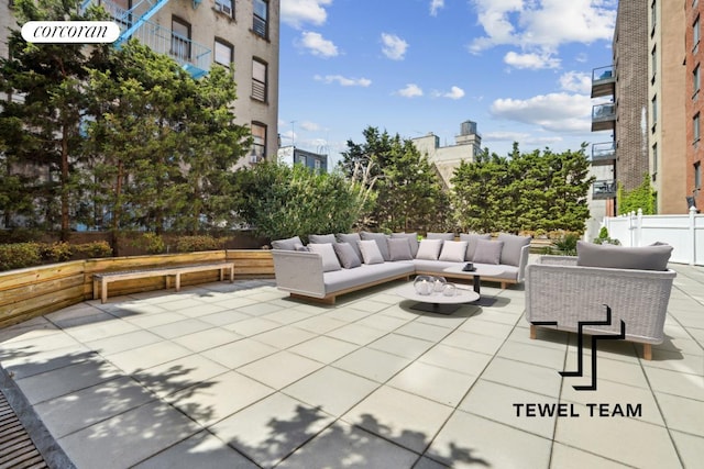 view of patio with fence and outdoor lounge area