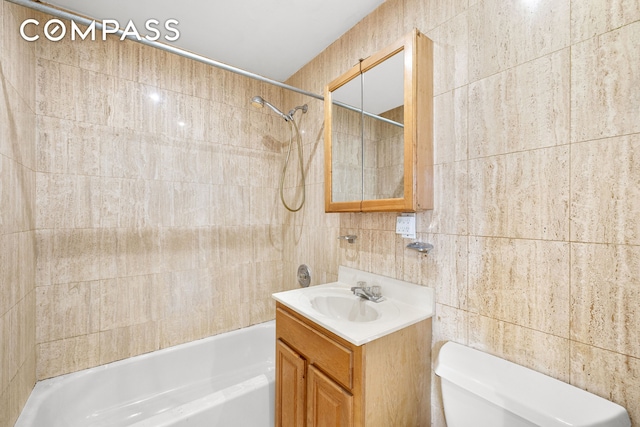 41-26 71st St Unit 1A, New York City, NY 11377 - full bathroom featuring tile walls,  shower combination, toilet, and vanity