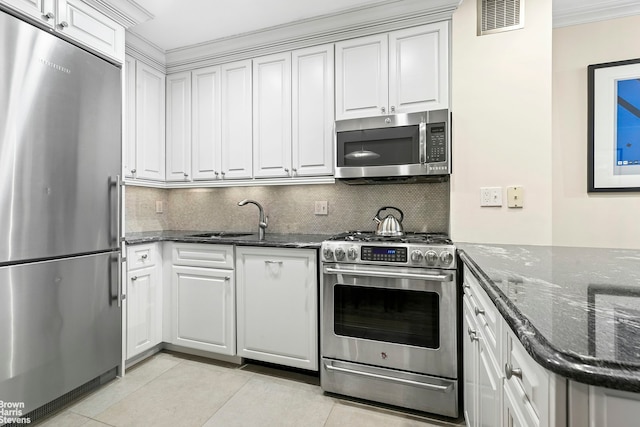 kitchen with crown molding, visible vents, tasteful backsplash, appliances with stainless steel finishes, and light tile patterned floors
