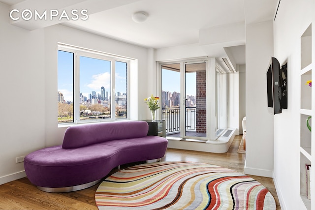 45 E End Ave Unit 6/7B, New York City, NY 10028 - sitting room with a view of city, wood finished floors, and baseboards