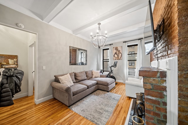 living room featuring baseboards, beamed ceiling, hardwood / wood-style floors, and a chandelier