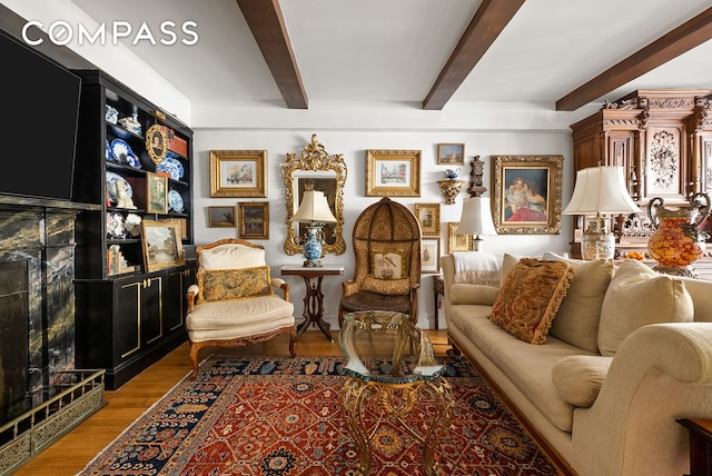 230 E 50th St Unit 3B, New York City, NY 10022 - living room featuring beamed ceiling and wood finished floors