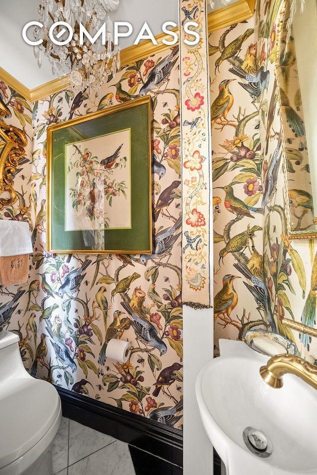 230 E 50th St Unit 3B, New York City, NY 10022 - half bath with marble finish flooring, a sink, toilet, and wallpapered walls