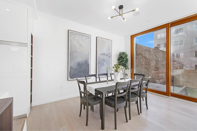 224 N 6th Street Parlour, New York City, NY 11211 - dining area featuring a chandelier and light wood-style flooring
