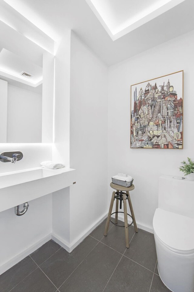 224 N 6th Street Parlour, New York City, NY 11211 - bathroom with tile patterned floors, toilet, and baseboards