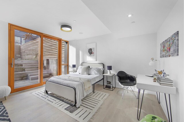 224 N 6th Street Parlour, New York City, NY 11211 - bedroom with wood finished floors, access to outside, and baseboards