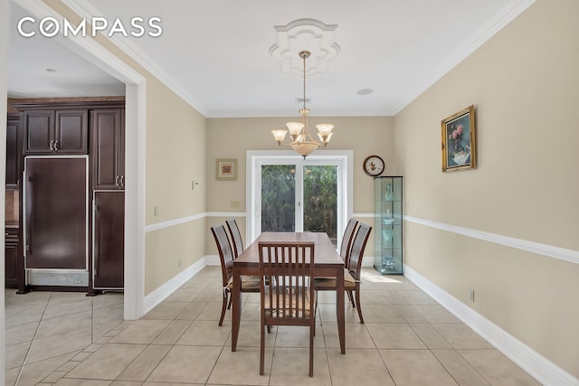 dining space with a chandelier, ornamental molding, and light tile patterned floors