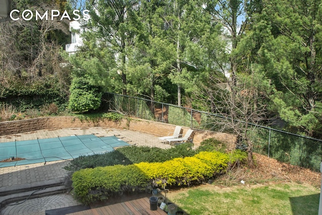 exterior space featuring a fenced in pool and a fenced backyard