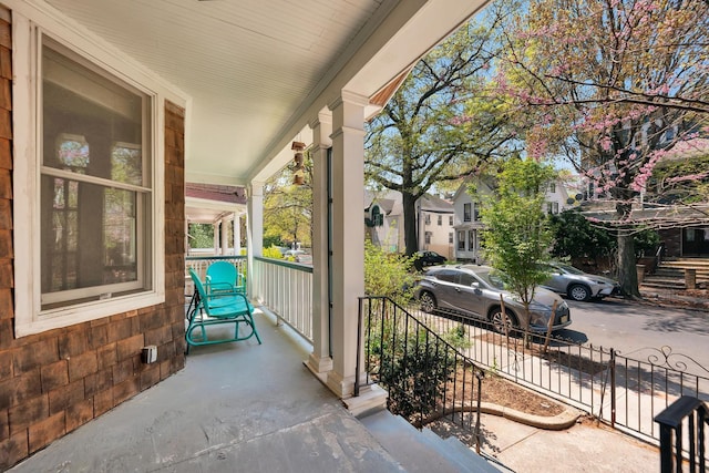 view of patio with fence and covered porch
