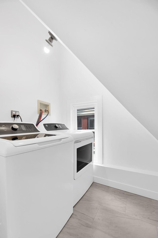 clothes washing area with laundry area and separate washer and dryer