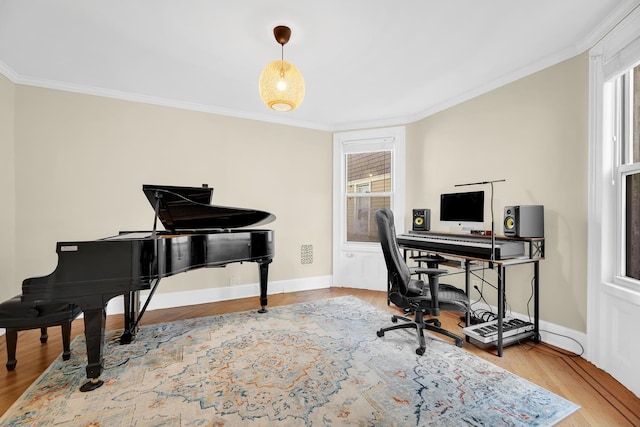 home office with baseboards, crown molding, and wood finished floors