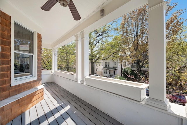 deck with a porch and ceiling fan