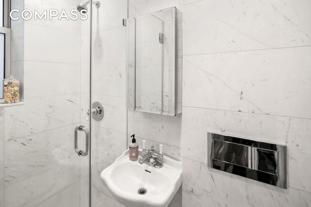 full bathroom with a sink and a stall shower