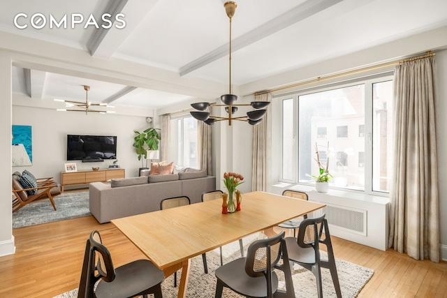 138 E 36th St Unit 4C, New York City, NY 10016 - dining area with a chandelier, beam ceiling, and light wood-style flooring