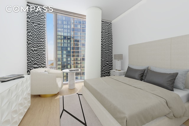 10 Riverside Blvd Unit 28C, New York City, NY 10069 - bedroom with wood finished floors and a view of city
