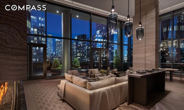 10 Riverside Blvd Unit 28C, New York City, NY 10069 - common area with a towering ceiling, a view of city lights, and expansive windows