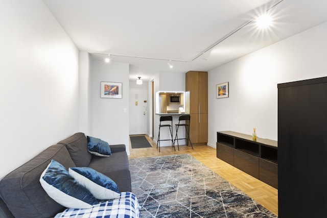 living room featuring track lighting