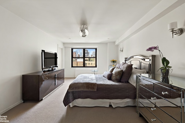 bedroom with carpet floors and baseboards