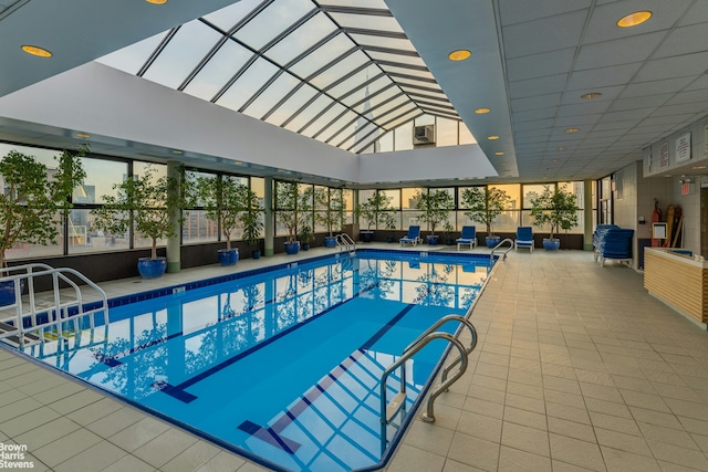 community pool featuring a lanai and a patio area