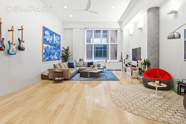 living room featuring recessed lighting, a ceiling fan, and hardwood / wood-style flooring