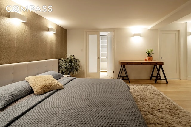 bedroom with wood finished floors