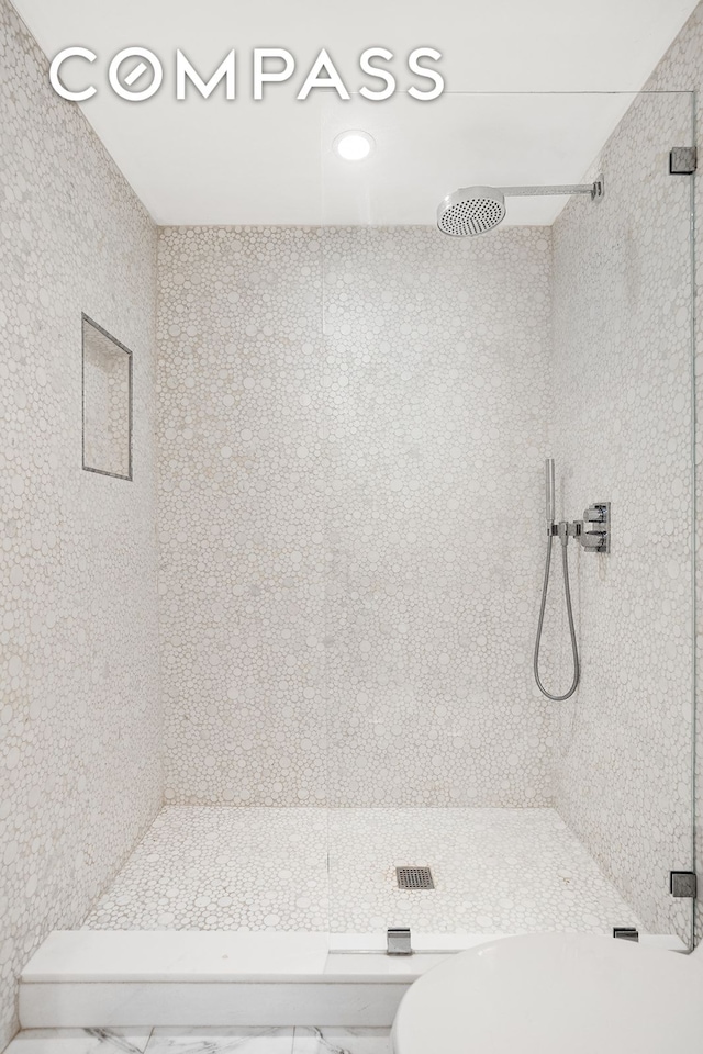 bathroom with a shower stall