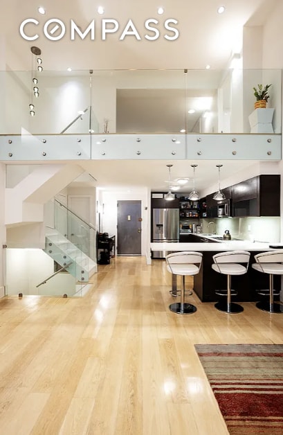 living room with recessed lighting, light wood finished floors, and stairs