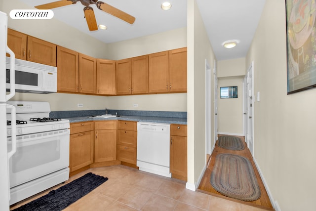 831 Carroll St Unit 4, New York City, NY 11215 - kitchen with white appliances, a sink, ceiling fan, light tile patterned flooring, and baseboards