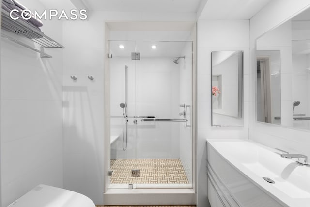 full bath with vanity, recessed lighting, toilet, and a shower stall