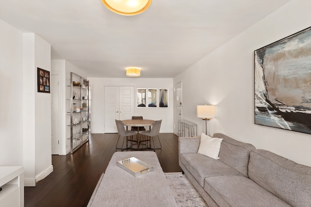 201 E 36th St Unit 17D, New York City, NY 10016 - living room featuring dark wood finished floors and baseboards