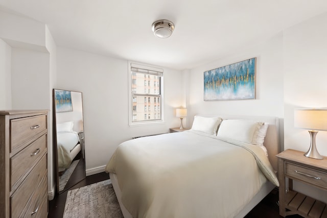 201 E 36th St Unit 17D, New York City, NY 10016 - bedroom featuring dark wood finished floors and baseboards