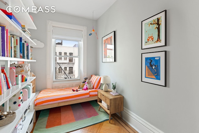 bedroom featuring baseboards