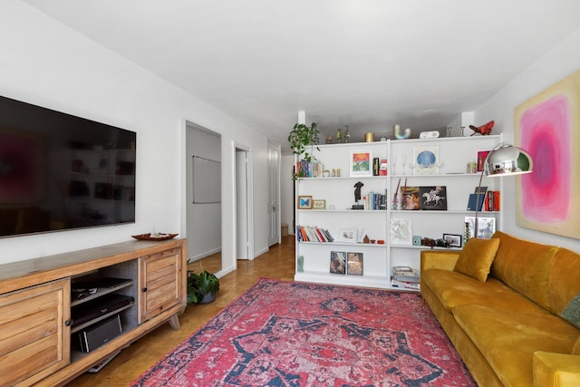 305 E 24th St Unit 4L, New York City, NY 10010 - living room featuring baseboards