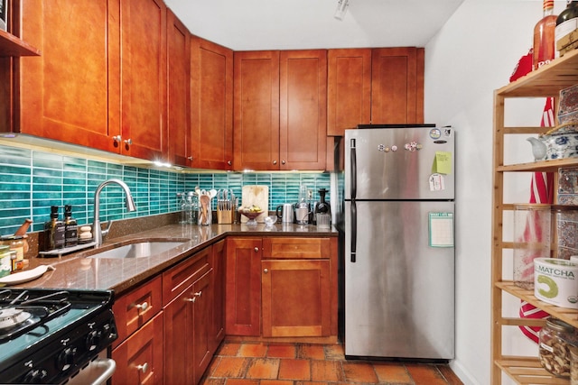 305 E 24th St Unit 4L, New York City, NY 10010 - kitchen featuring freestanding refrigerator, open shelves, dark stone counters, tasteful backsplash, and brown cabinets