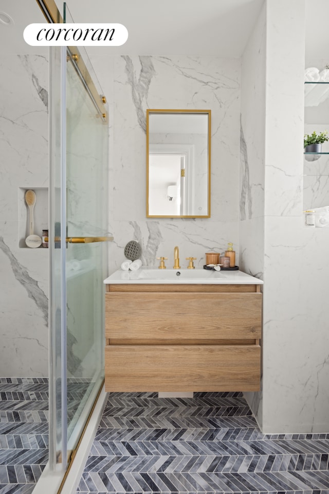 1235 Dean St Unit 5, New York City, NY 11216 - bathroom with a marble finish shower, vanity, and brick patterned flooring